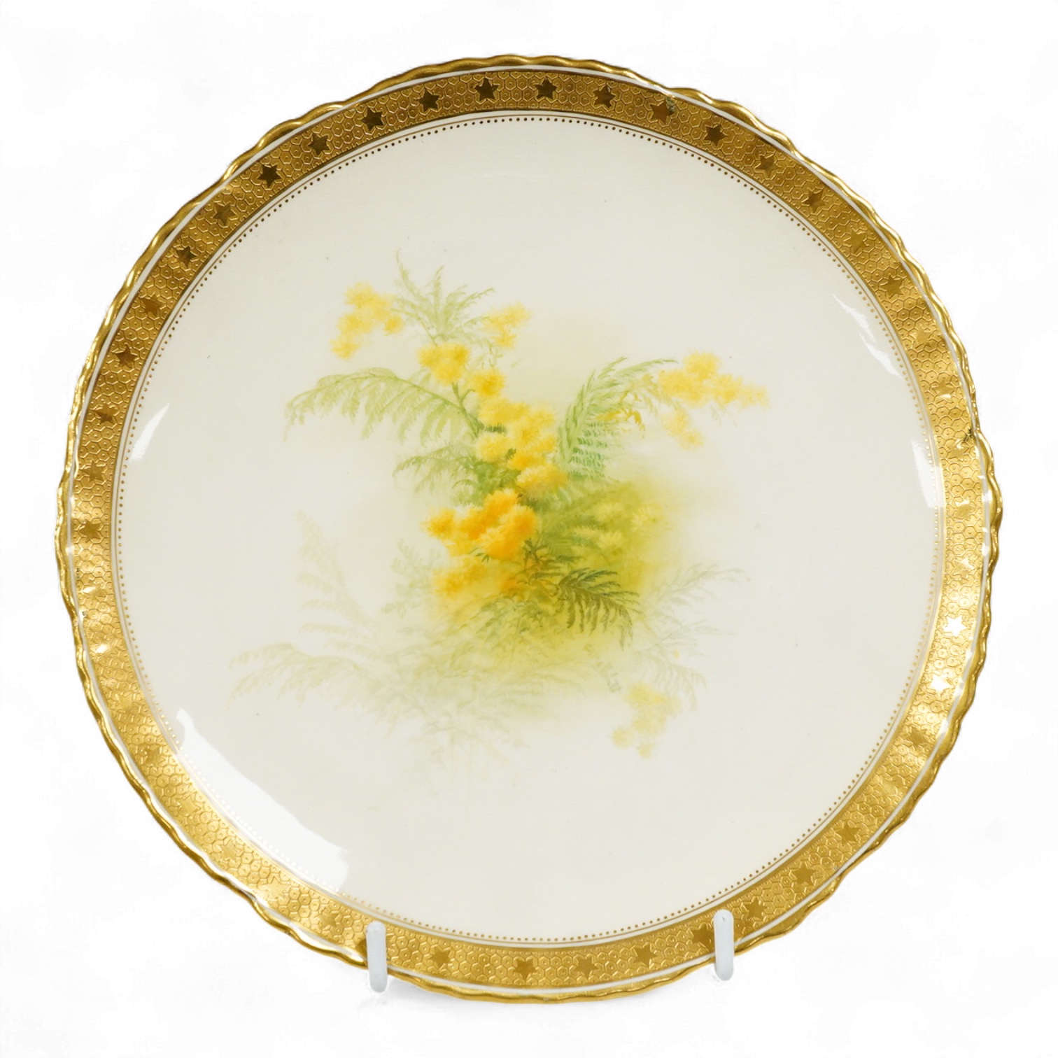 A Mintons yellow floral plate with tooled gilt border, 22cm in diameter